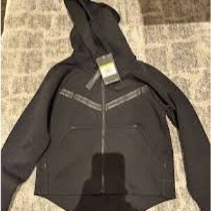 Black hoodie with zipper. Has a hood and a Nike logo on the tag.